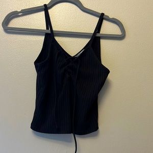 black cross tie in middle black tank top/ slightly cropped